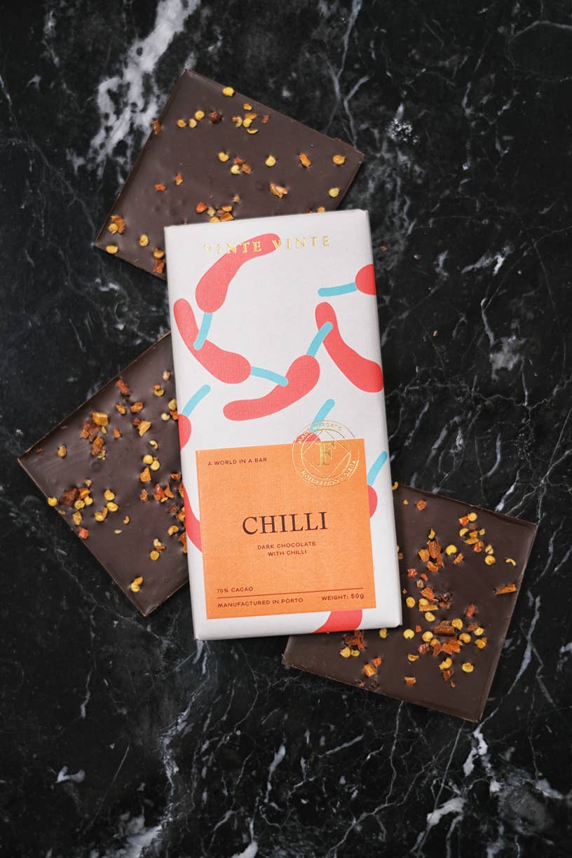 Vinte Vinte Chocolate Fusion Dark Chocolate 70% with Chili, 50g bar showing glossy dark chocolate squares with chili flakes.