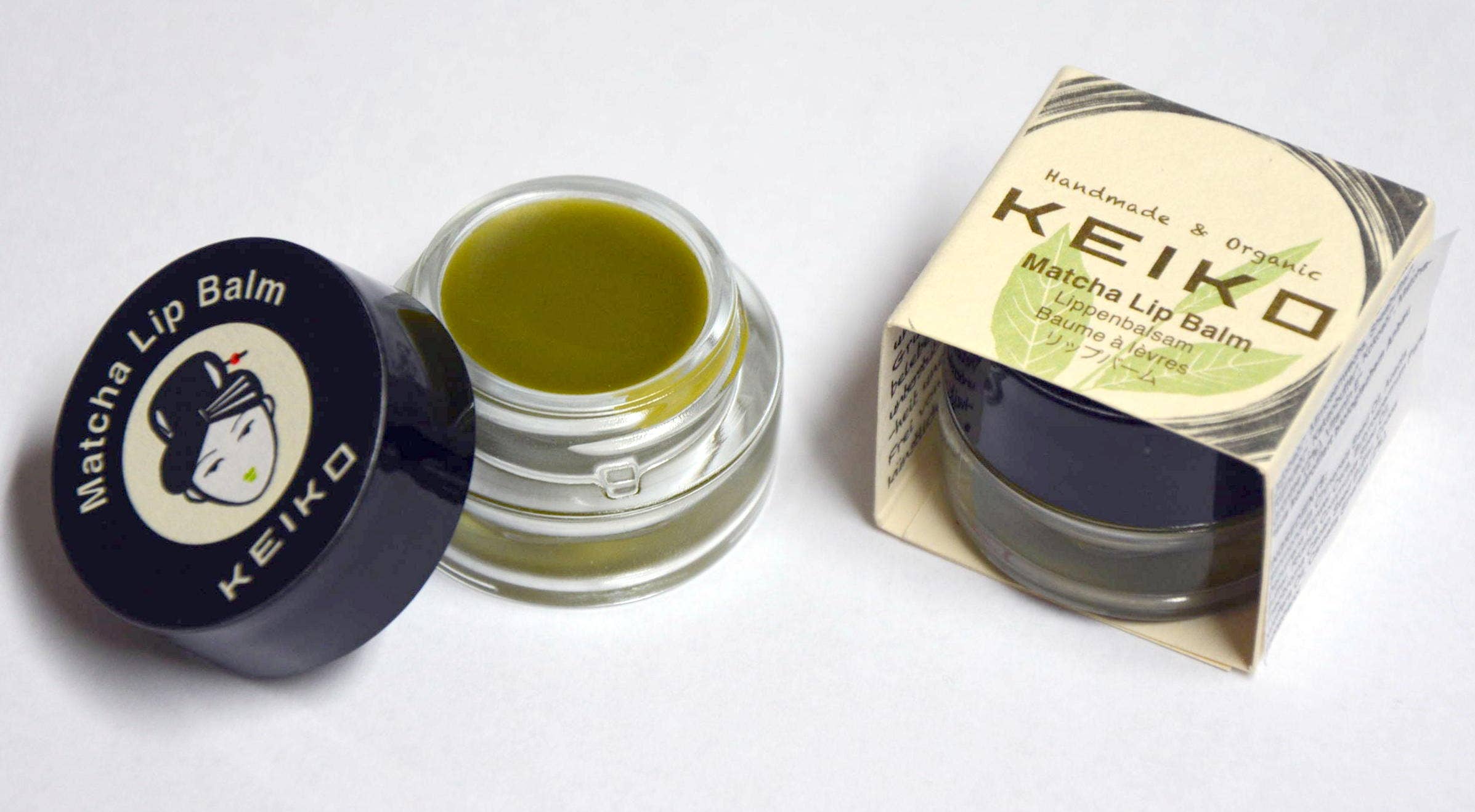 Keiko Organic Matcha Lip Balm tube with green label and white cap, showcasing natural ingredients and eco-friendly packaging.