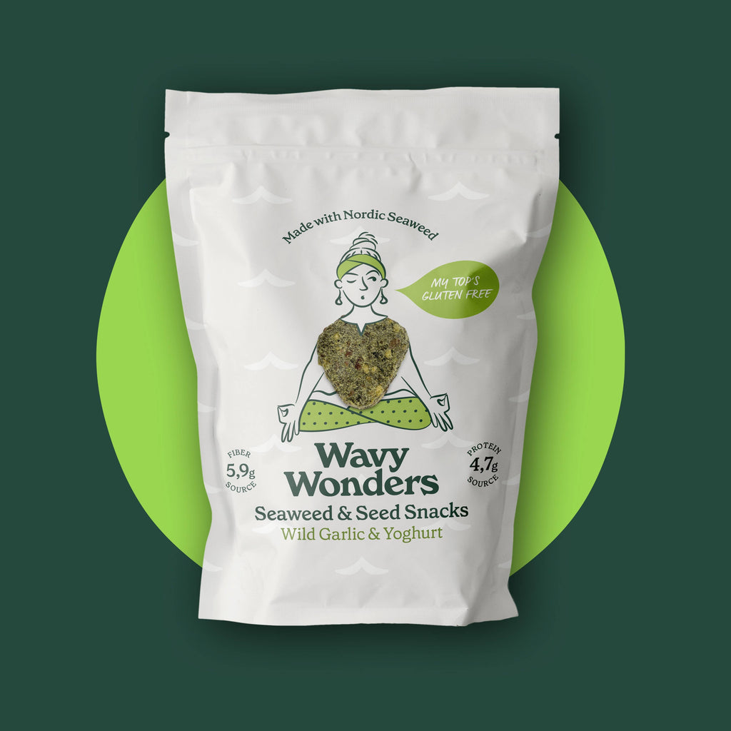 Wavy Wonders Seaweed and Seed Snacks with wild garlic and yoghurt flavor, showing crispy snack pieces in a clear bowl.