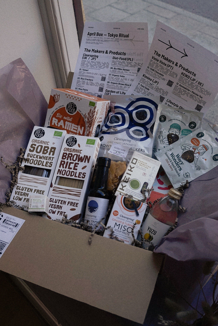 GRAINED The Monthly Box snacks with assorted packaged snack items arranged inside a box.