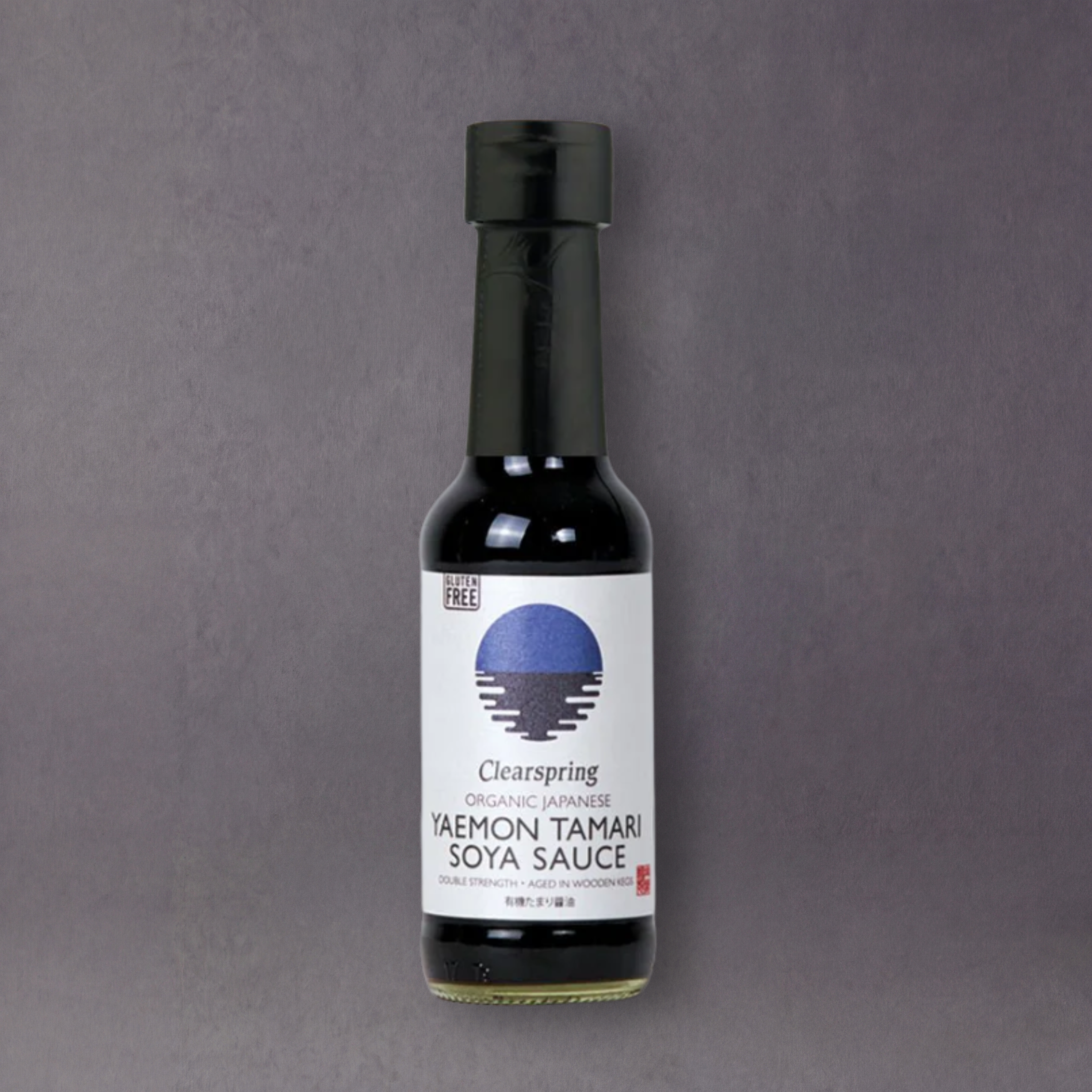 ClearSpring Tamari soy sauce bottle from GRAINED, featuring a dark liquid inside a glass bottle with a white label.