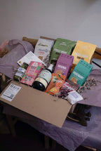 Assorted GRAINED The Monthly Box snack selection with various packaged snacks in a display tray.