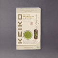 Organic Keiko Genmaicha and Matcha tea blend in a package, featuring green tea leaves, roasted rice, and vibrant green matcha powder.