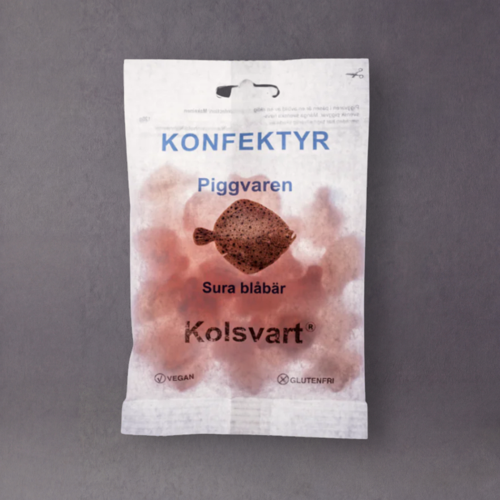 Organic Swedish candy called Kolsvart Konfektyr by GRAINED, featuring colorful, pig-shaped sweets in a close-up view.