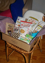 Assorted snack items from GRAINED's November The Monthly Box, featuring a variety of packaged healthy snacks.