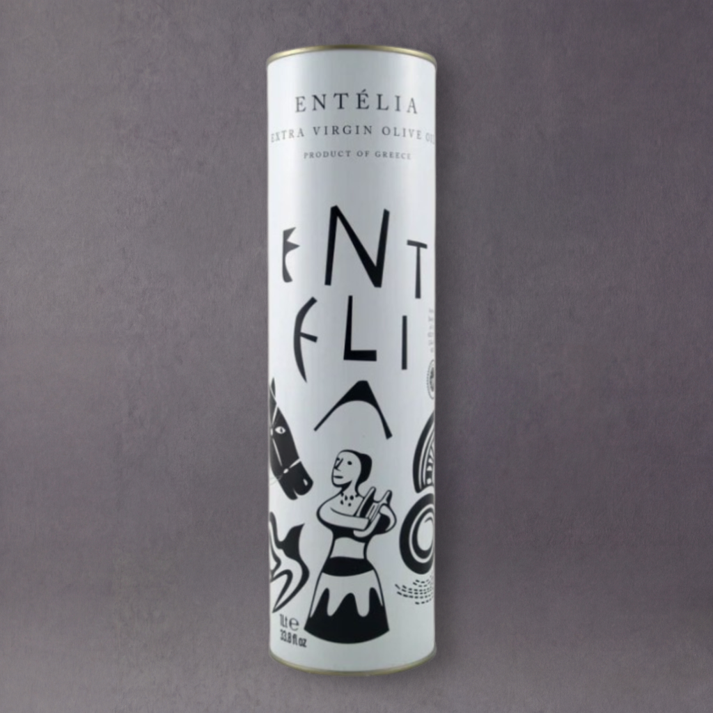 GRAINED Entèlia Kreta Extra Virgin Olive Oil in 1L bottle, golden-green liquid with olive groves background, premium quality.