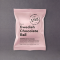 GRAINED Dig Snacks Swedish Fika Treats in all 15 flavors, featuring colorful chocolate balls on a white background.