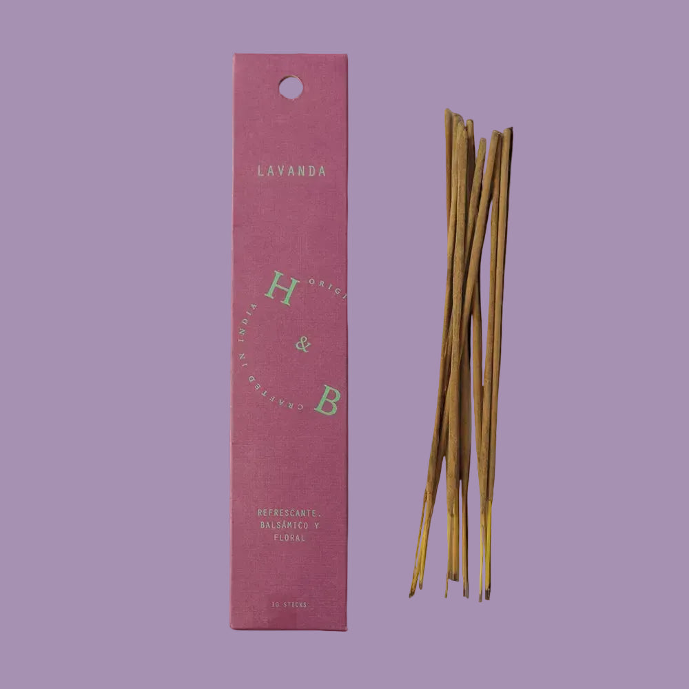 Incense sticks with a pink packaging labeled 'Lavanda' on a lavender background
