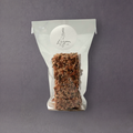 Lagom by Kak Seed Crackers, gluten-free Swedish crackers with visible seeds, displayed on a wooden surface.
