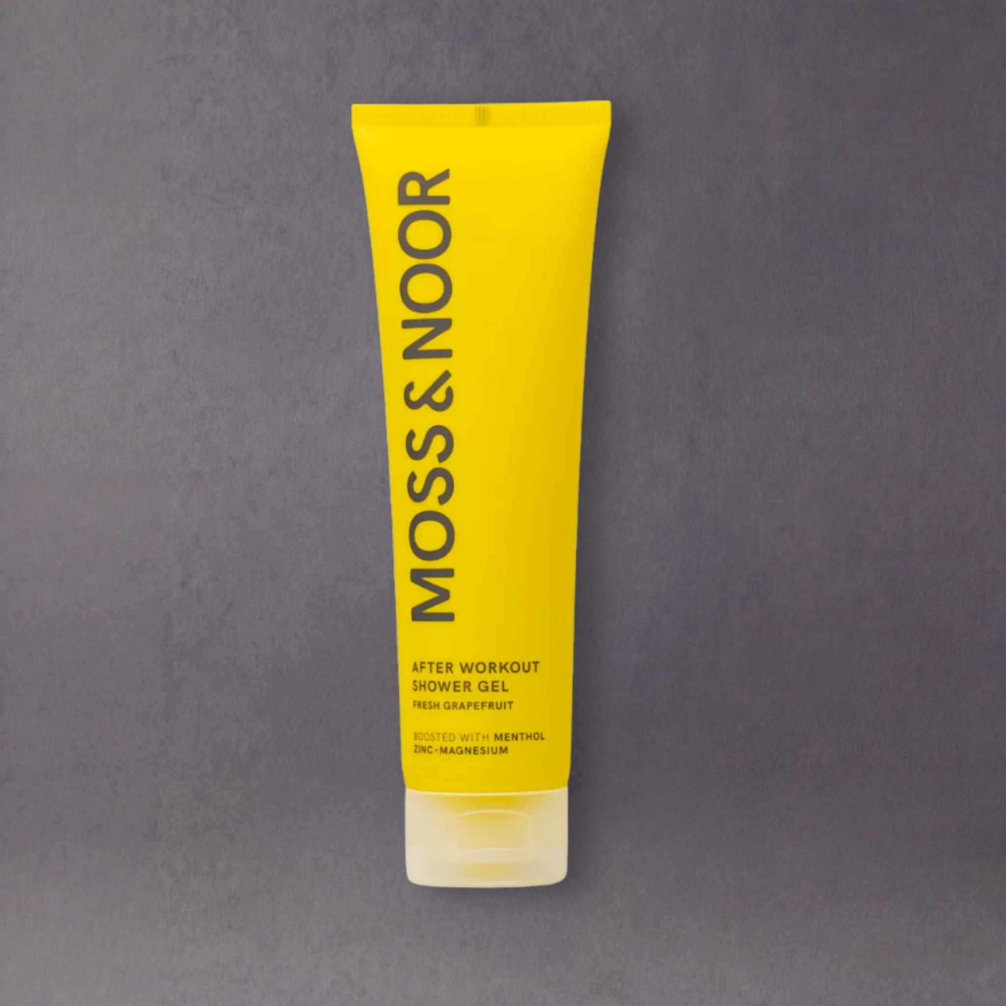 Natural Swedish body-care product by GRAINED featuring moss and herbal ingredients in a sleek bottle.